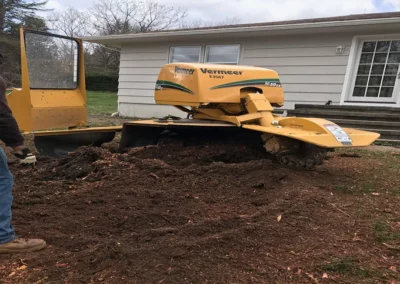 A stump grinder during stump grinding in Bristol, CT
